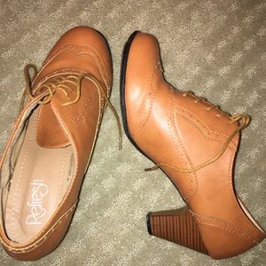 Tan “saddle shoe” style ankle boots